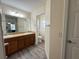 Double vanity bathroom with a toilet and separate shower at 12046 Ne 51St Cir, Oxford, FL 34484
