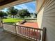 Private backyard patio with seating area and view of neighborhood at 12046 Ne 51St Cir, Oxford, FL 34484