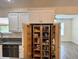 Well-organized pantry with ample shelving for food storage at 12046 Ne 51St Cir, Oxford, FL 34484
