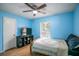 Cozy bedroom with light blue walls and a double bed at 3460 Laurel Dr, Mount Dora, FL 32757