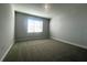 Bright bedroom with carpet flooring and a window with blinds at 2003 Sunshine Peak Dr, Minneola, FL 34715
