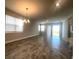 Dining room features tile floors and access to backyard at 2003 Sunshine Peak Dr, Minneola, FL 34715