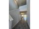 Bright entryway with staircase and view to living room at 2003 Sunshine Peak Dr, Minneola, FL 34715