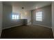 Spacious loft area with window and carpet flooring at 2003 Sunshine Peak Dr, Minneola, FL 34715