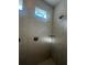 Walk-in shower with tiled walls and multiple shower heads at 2003 Sunshine Peak Dr, Minneola, FL 34715