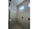 Shower stall with tile surround and built-in shelves at 2003 Sunshine Peak Dr, Minneola, FL 34715