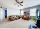 Spacious bonus room featuring two comfortable sofas and a large TV at 172 Seville Dr, Davenport, FL 33837