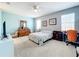 Comfortable bedroom with a queen bed, dresser, and ceiling fan at 172 Seville Dr, Davenport, FL 33837