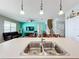 Open kitchen with a large island and stainless steel appliances, overlooking living room at 172 Seville Dr, Davenport, FL 33837