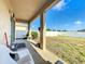 Covered patio overlooking a grassy backyard at 172 Seville Dr, Davenport, FL 33837