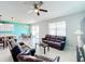 Spacious living room with leather couches and a view of the kitchen and dining area at 172 Seville Dr, Davenport, FL 33837