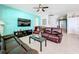 Relaxing living room with leather sofas and a large flat-screen TV at 172 Seville Dr, Davenport, FL 33837