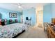 Spacious bedroom with a queen bed, ceiling fan, and access to the bathroom at 172 Seville Dr, Davenport, FL 33837