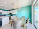 Bright dining area with seating for six, adjacent to the kitchen at 172 Seville Dr, Davenport, FL 33837