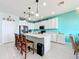 Kitchen with island, stainless steel appliances, and white cabinets at 172 Seville Dr, Davenport, FL 33837