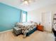 Charming bedroom with a king-size bed, tropical bedding, and neutral walls at 172 Seville Dr, Davenport, FL 33837