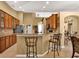 Kitchen with breakfast bar, granite countertops, and stainless steel dishwasher at 13144 Coldwater Loop, Clermont, FL 34711