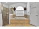 Relaxing bathroom with soaking tub and walk-in shower at 13144 Coldwater Loop, Clermont, FL 34711