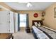 Bedroom featuring a full-sized bed, window with blinds and closet at 13144 Coldwater Loop, Clermont, FL 34711