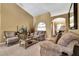 Living room with beige sofas, coffee table, and decorative accents at 13144 Coldwater Loop, Clermont, FL 34711