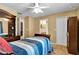 Bright bedroom with a bookshelf, window, and view of another room at 13144 Coldwater Loop, Clermont, FL 34711