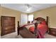 Cozy bedroom featuring a wooden bed frame and ample closet space at 13144 Coldwater Loop, Clermont, FL 34711