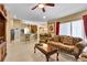 Open living room with views into kitchen and breakfast area at 13144 Coldwater Loop, Clermont, FL 34711