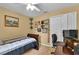 Bright bedroom with a double bed, workspace, and ample wall space at 13144 Coldwater Loop, Clermont, FL 34711