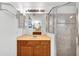 Bathroom with vanity, shower and good lighting at 13144 Coldwater Loop, Clermont, FL 34711