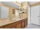 Double vanity bathroom with a large mirror and plenty of storage at 13144 Coldwater Loop, Clermont, FL 34711