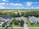 Aerial view of a house in a residential neighborhood at 13144 Coldwater Loop, Clermont, FL 34711