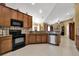Spacious kitchen with granite countertops, stainless steel appliances, and ample cabinetry at 13144 Coldwater Loop, Clermont, FL 34711