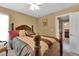 Well-lit bedroom with double doors leading to another room at 13144 Coldwater Loop, Clermont, FL 34711