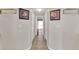 Bright hallway with tile flooring and access to bedrooms at 13144 Coldwater Loop, Clermont, FL 34711