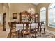 Elegant dining room with a formal table setting and hardwood floors at 13144 Coldwater Loop, Clermont, FL 34711