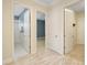 Hallway with doors to bedrooms and bathroom at 6514 Crews Lake Crest Loop, Lakeland, FL 33813