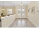 Light and airy entryway with white double doors and hardwood floors at 6514 Crews Lake Crest Loop, Lakeland, FL 33813