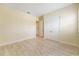 Bright bedroom with double doors and wood floors at 6514 Crews Lake Crest Loop, Lakeland, FL 33813