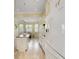 Open concept kitchen with white appliances and view into dining area at 6514 Crews Lake Crest Loop, Lakeland, FL 33813