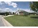 Single story home with brick accents and a nicely landscaped lawn at 6514 Crews Lake Crest Loop, Lakeland, FL 33813