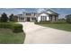 Two-story home with brick and white siding at 6514 Crews Lake Crest Loop, Lakeland, FL 33813
