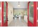 Bright entryway with red double doors and hardwood floors at 6514 Crews Lake Crest Loop, Lakeland, FL 33813