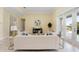 Living room with hardwood floors, white couch and access to backyard at 6514 Crews Lake Crest Loop, Lakeland, FL 33813