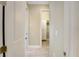 Hallway with light walls and wood-look floors leading to a walk-in closet at 6514 Crews Lake Crest Loop, Lakeland, FL 33813