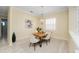 Elegant dining area with a wood table, chandelier, and neutral decor at 6514 Crews Lake Crest Loop, Lakeland, FL 33813