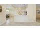 Modern white kitchen with center island and breakfast nook at 6514 Crews Lake Crest Loop, Lakeland, FL 33813