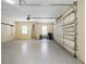 Spacious two-car garage with overhead storage and ample floor space at 6514 Crews Lake Crest Loop, Lakeland, FL 33813