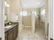 Bathroom with walk in shower, double vanity, and modern finishes at 6514 Crews Lake Crest Loop, Lakeland, FL 33813