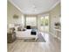 Bright bedroom featuring a king-size bed, hardwood floors and sliding glass doors leading to the backyard at 6514 Crews Lake Crest Loop, Lakeland, FL 33813