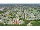 Wide aerial view showcasing the property and surrounding neighborhood at 410 Tarrson Blvd, The Villages, FL 32159